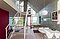 Akustikloft med trælameller i åbent rum med loft til kip. Nybygget hus af arkitekt Jesper Korf