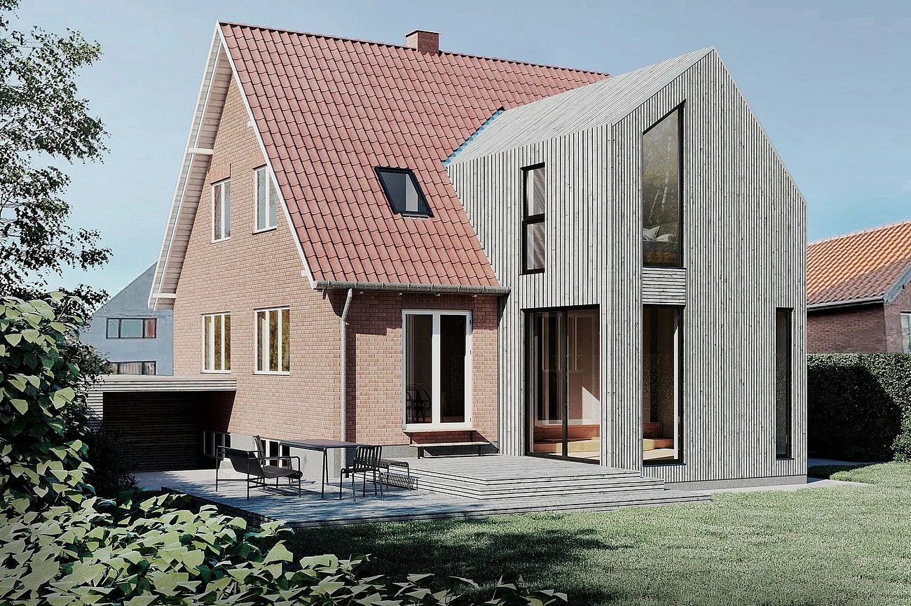 Moderne tilbygning beklædt i træ i kontrast til murermestervilla fra 50'erne