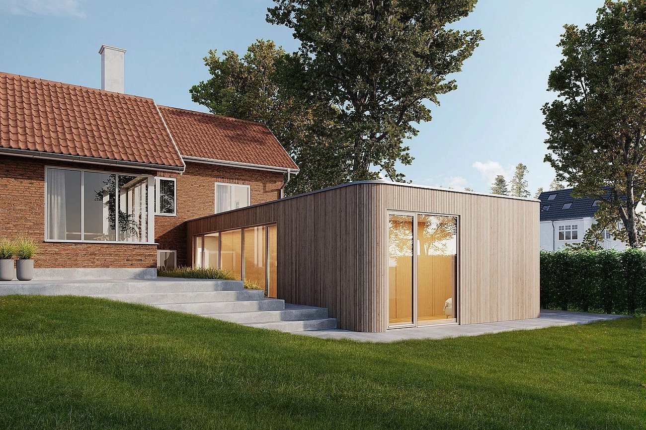 Moderne trætilbygning til rødstensvilla 50'erne