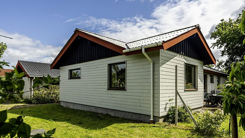 Tilbygning med lille sidebygning